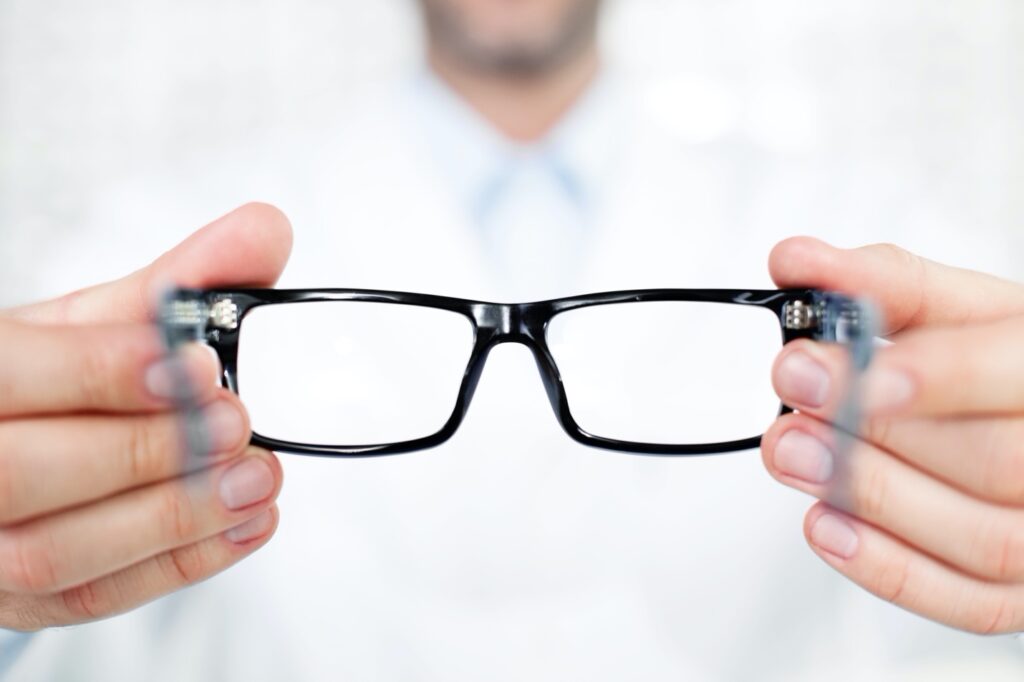 A picture containing person, hand, spectacles Description automatically generated